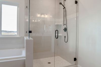 Walk-in Shower Featuring Black Frame Hardware